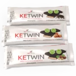 KE TWIN: Barretta proteica multilayer con cioccolato fondente e caramello. KE TWIN: Barre protéinée multicouche chocolat noir et caramel.